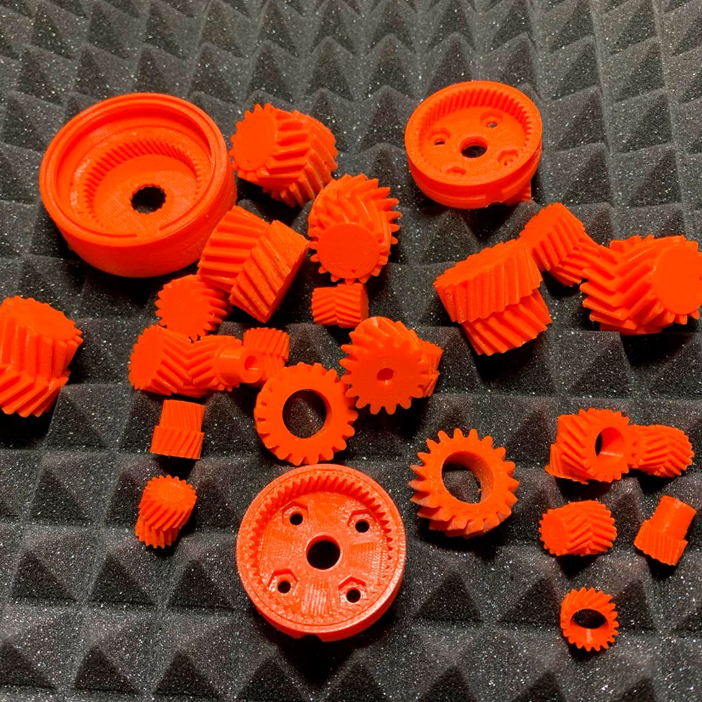 Mecadispro Impresora 3D engranajes diferentes tamaños color naranja impresos con impresora 3d